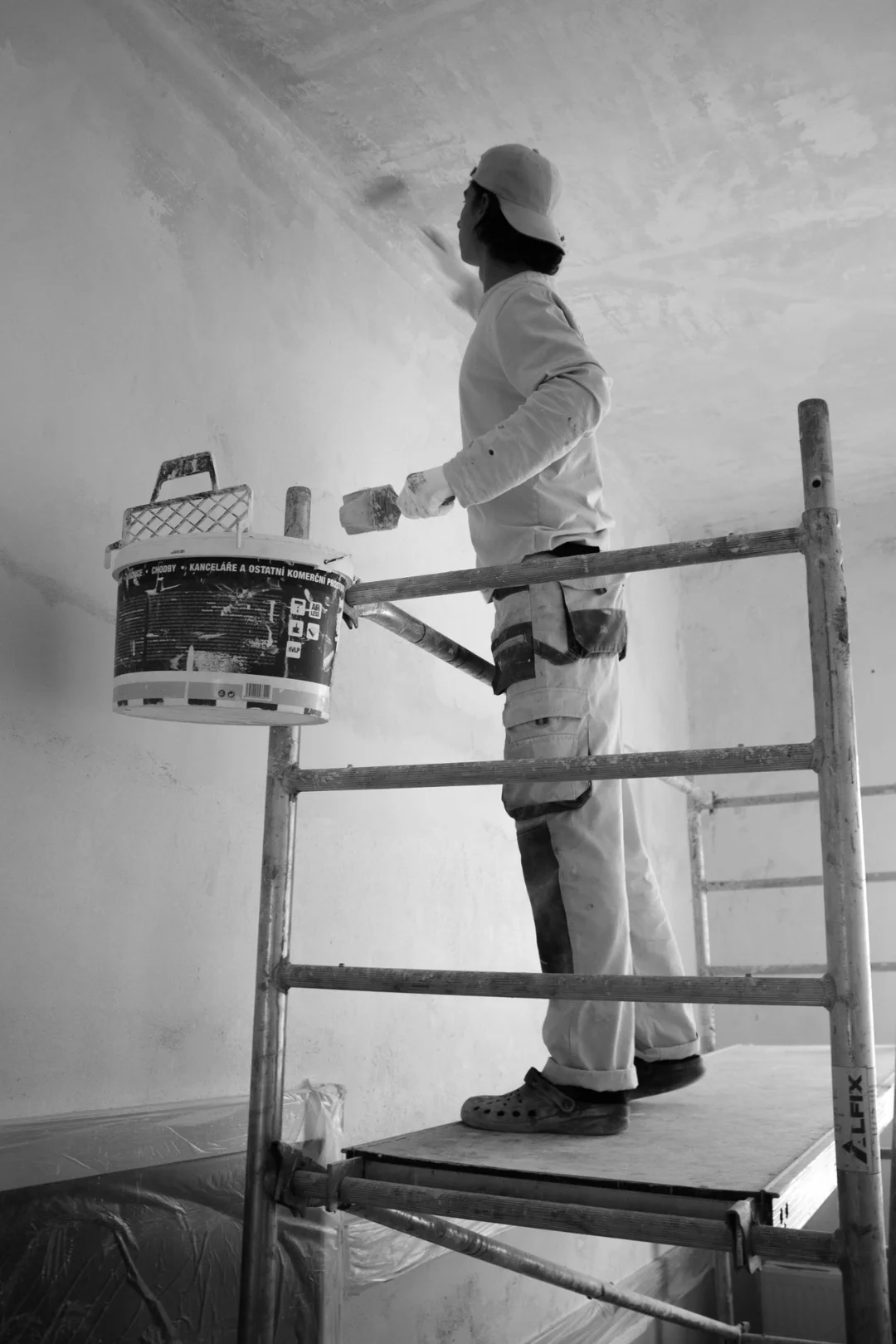 Painter working on interior wall of a Modesto home