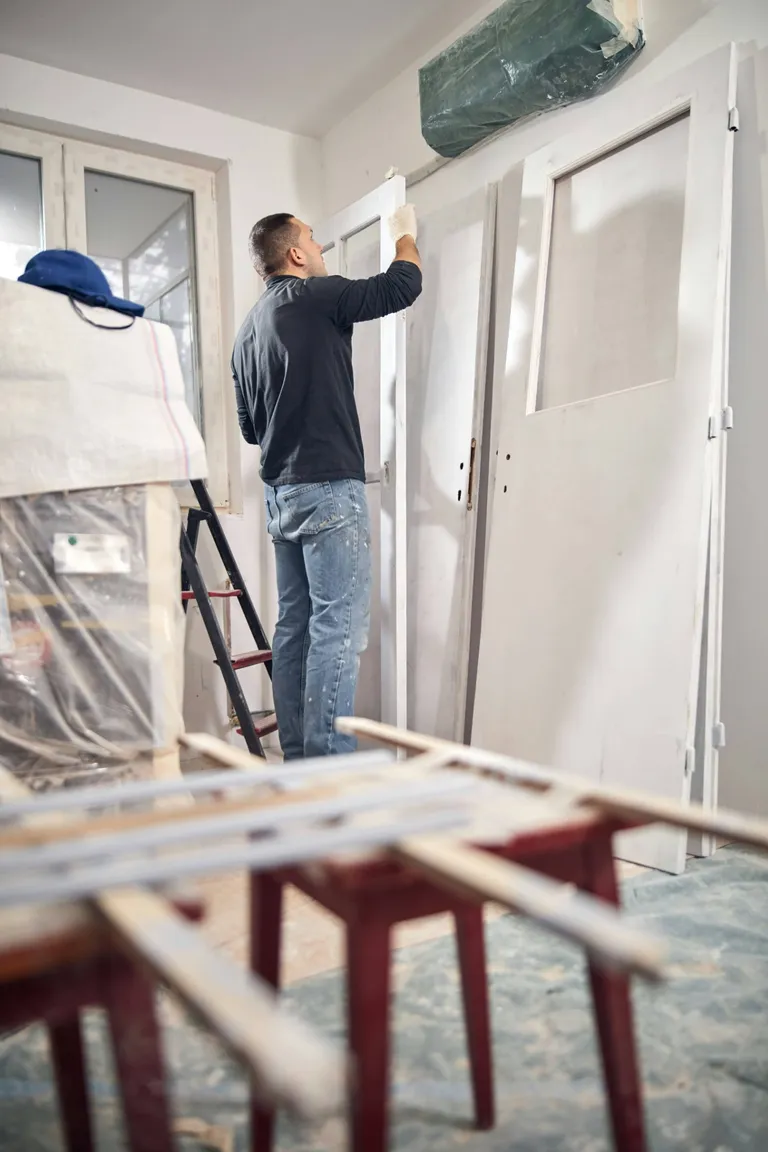 Professional painter prepping walls for residential repainting in Modesto